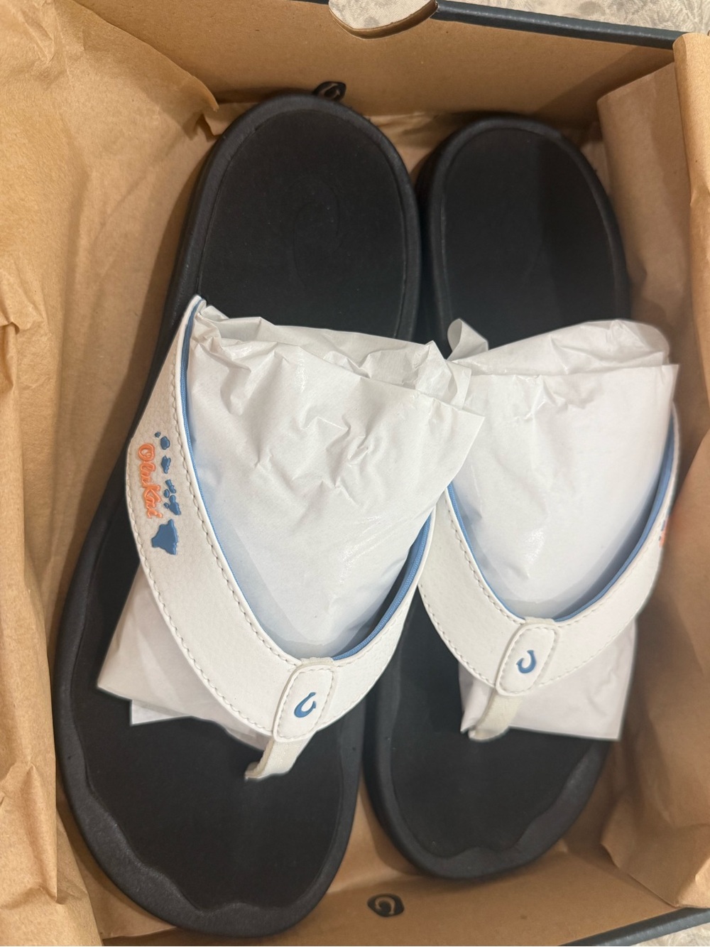 Olukai White and Black Flip-Flop Sandals